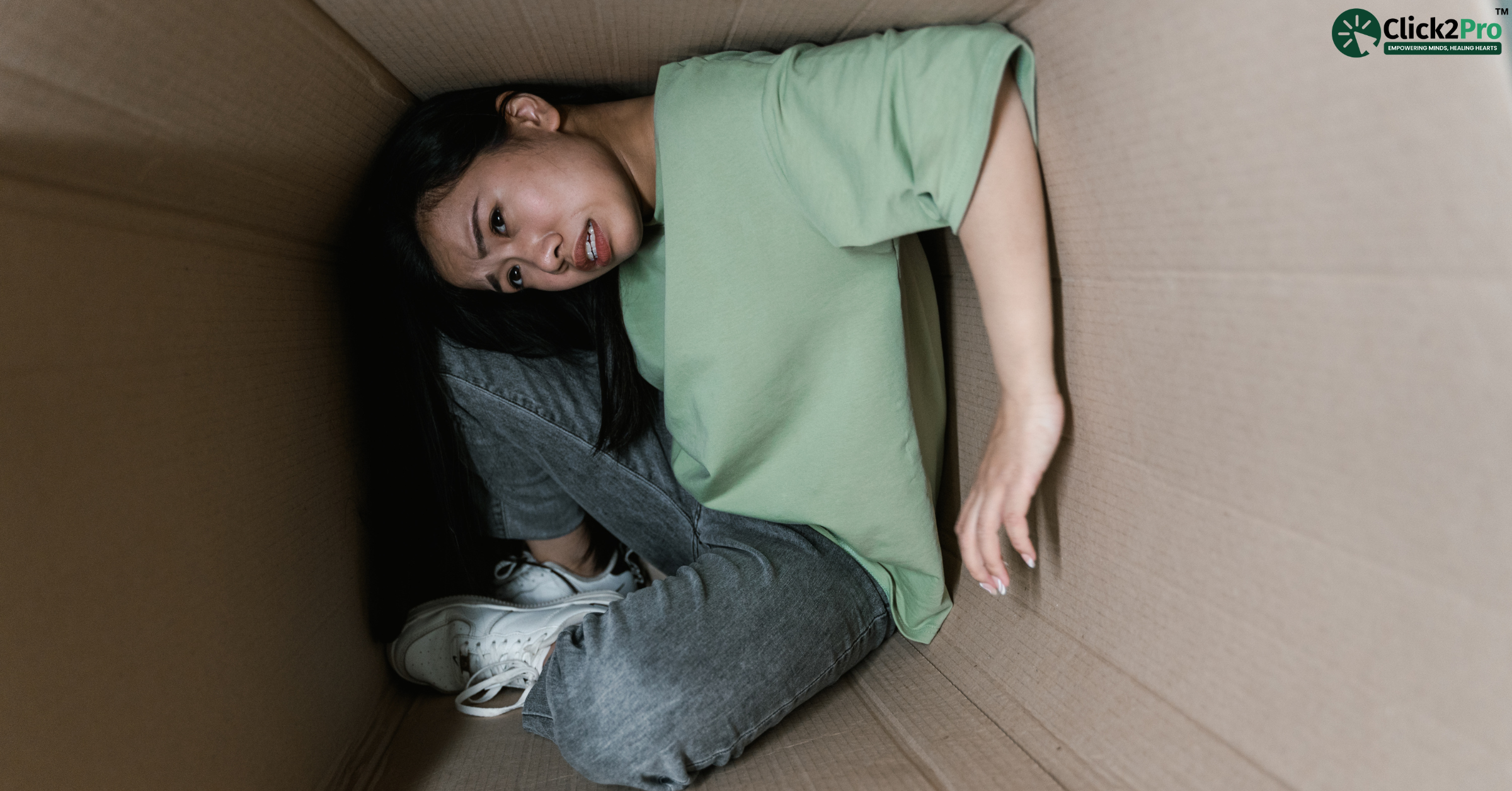 Young woman experiencing claustrophobia in a confined space – signs, causes, and treatment insights.