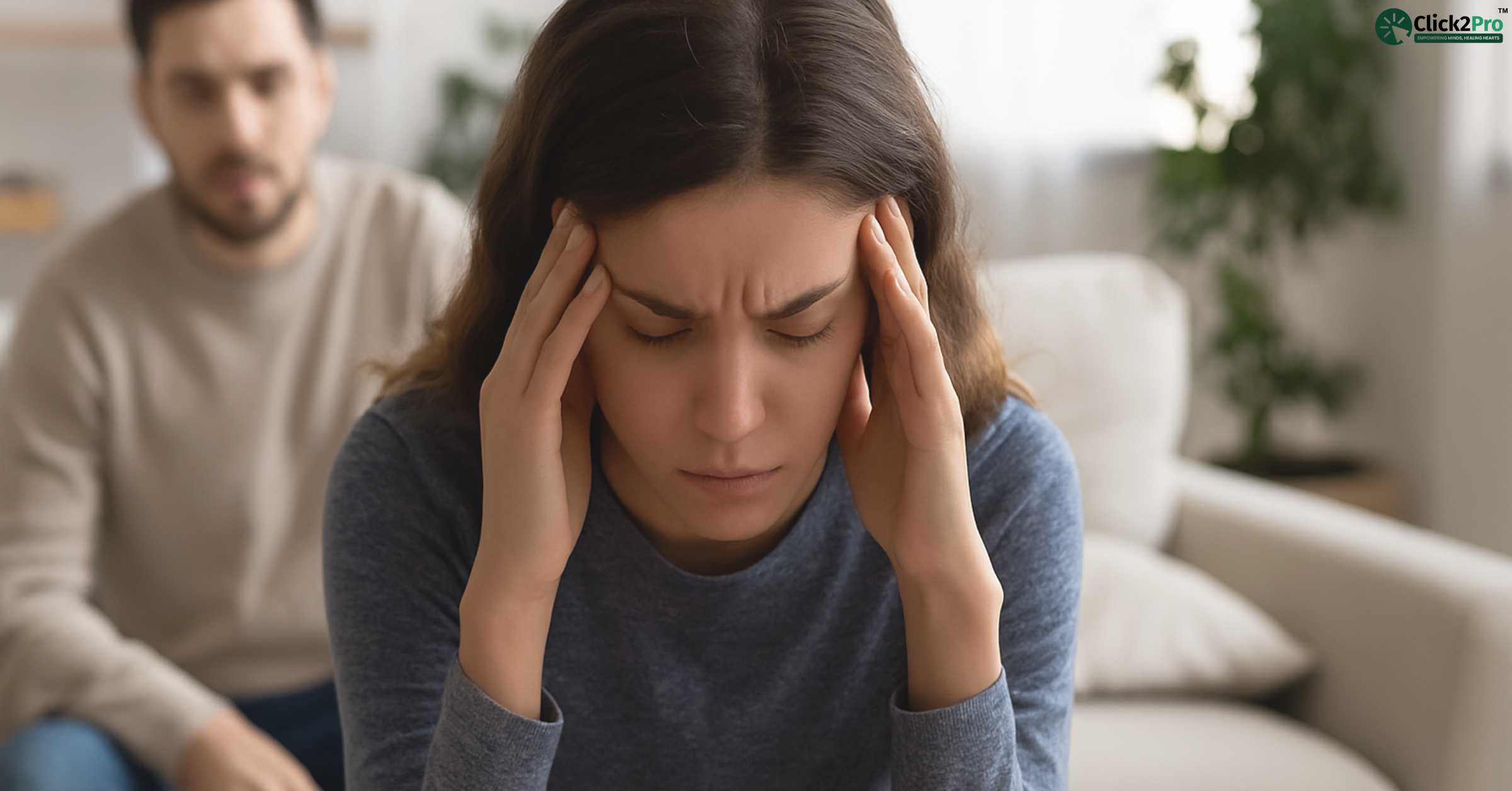 Woman with anxiety holding head, showing stress and panic from déjà vu episode