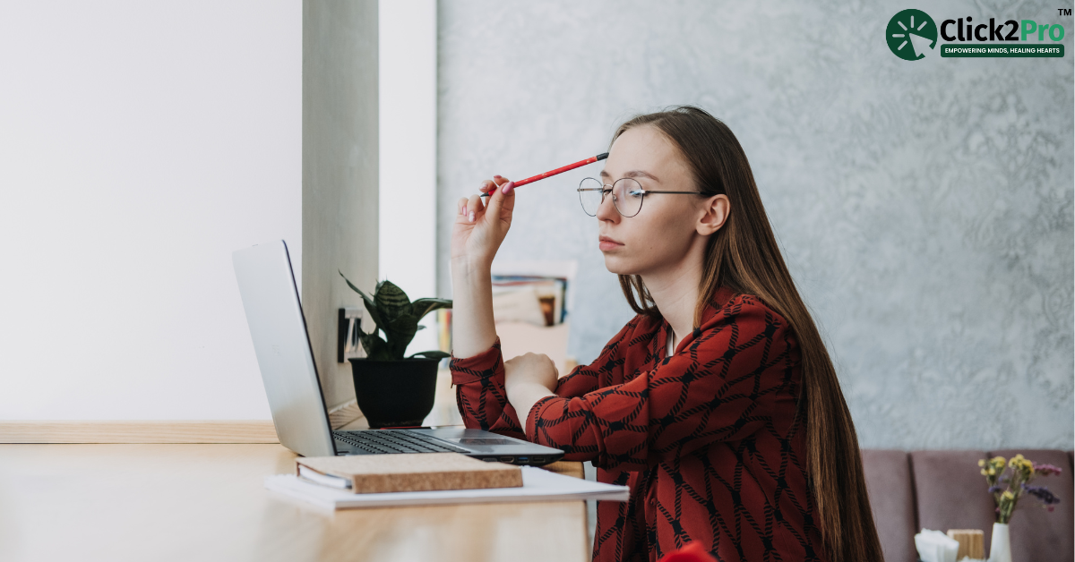 Student experiencing exam stress while studying with a laptop, reflecting mental health impact.