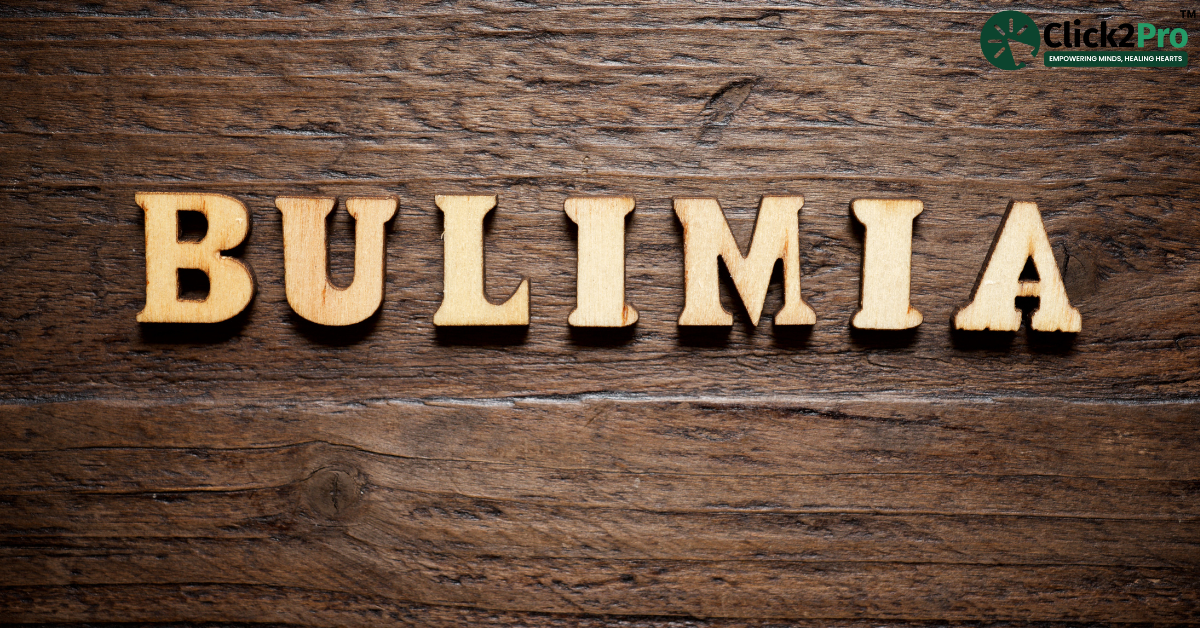 Bulimia wooden text on a wooden surface with Click2Pro logo - Bulimia and mental health awareness.