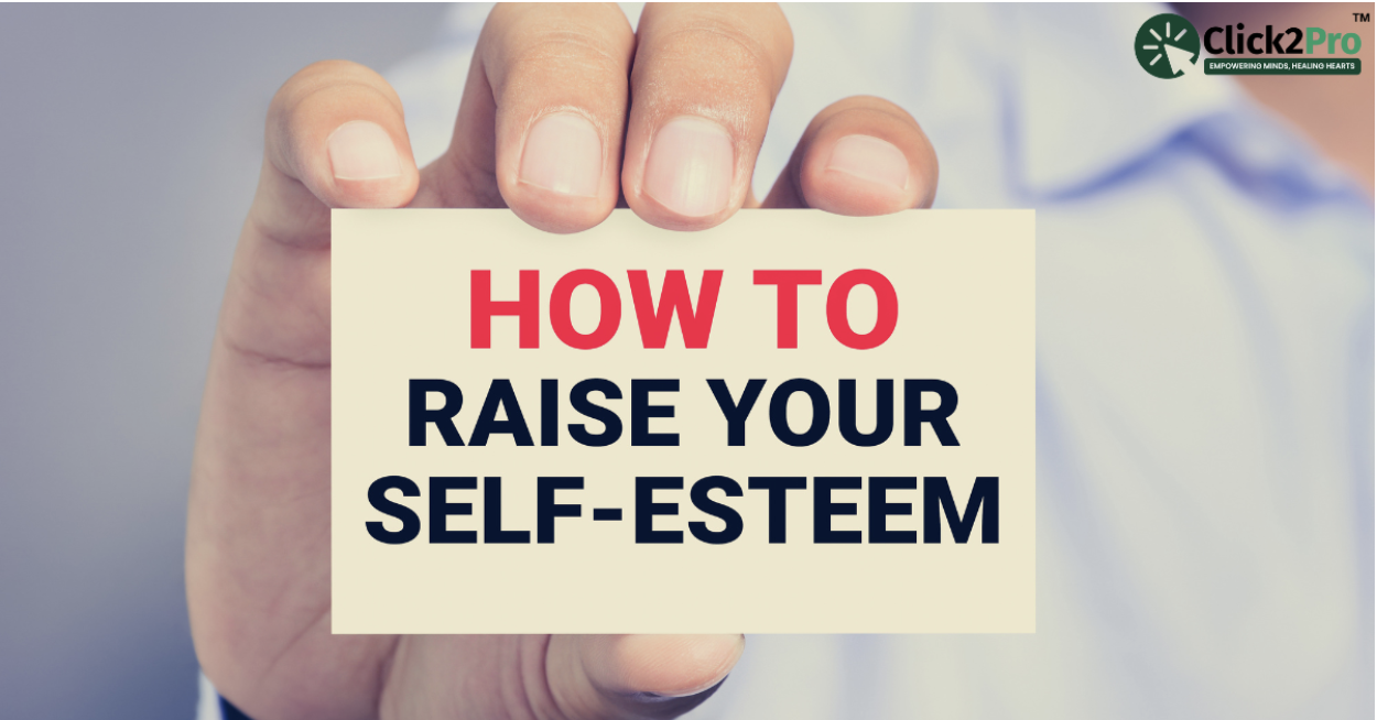 Person holding a card that says 'How to Raise Your Self-Esteem' - Click2Pro blog on boosting self-esteem.