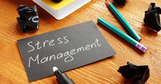 Stress Management Techniques and Tips - Black Card on Desk with Pens and Crumpled Papers