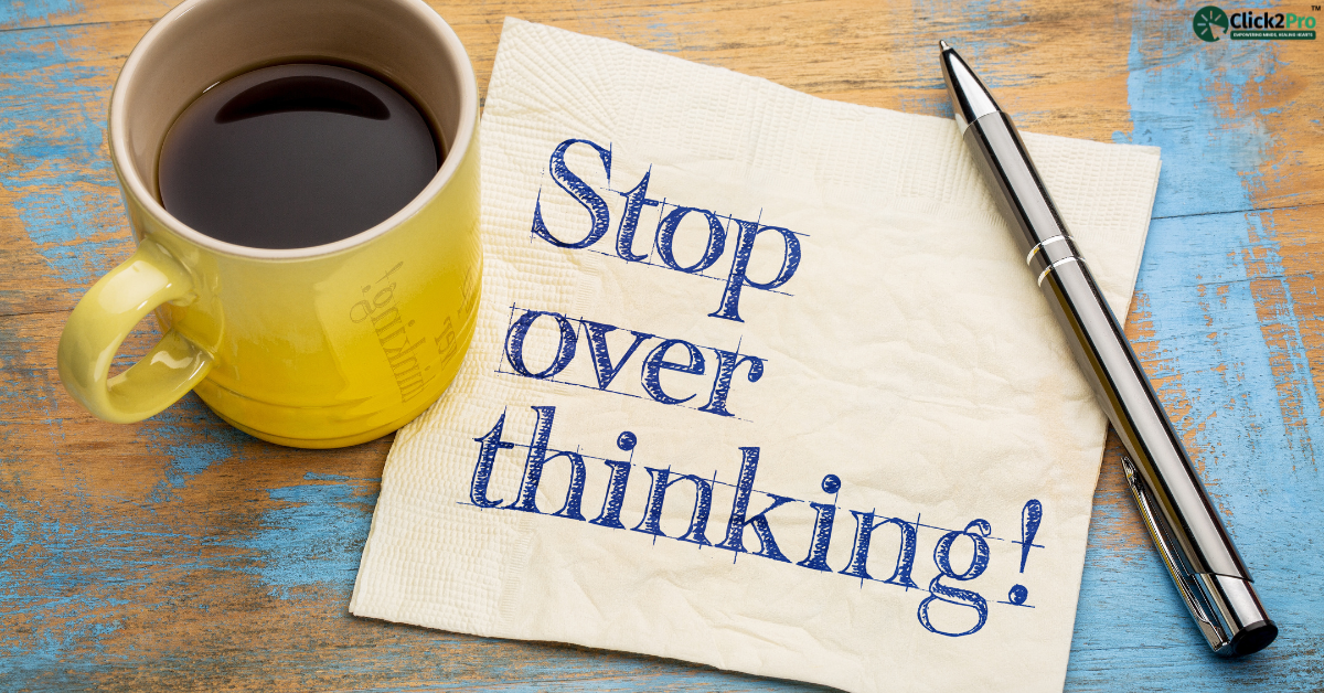 Stop overthinking message written on a napkin next to a coffee cup, promoting mental health awareness.