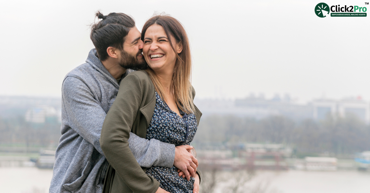 Happy couple embracing outdoors, showcasing love and connection after parenthood challenges.