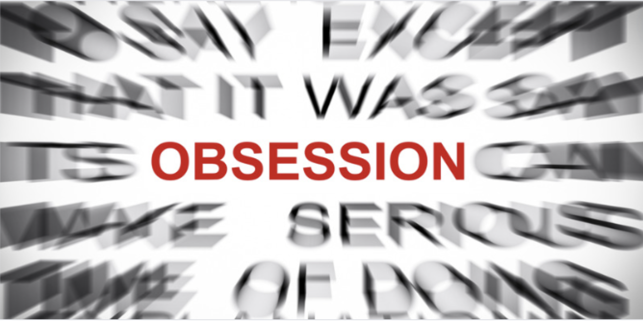 Obsession text focus with blurred background, illustrating the intensity of obsessive thoughts