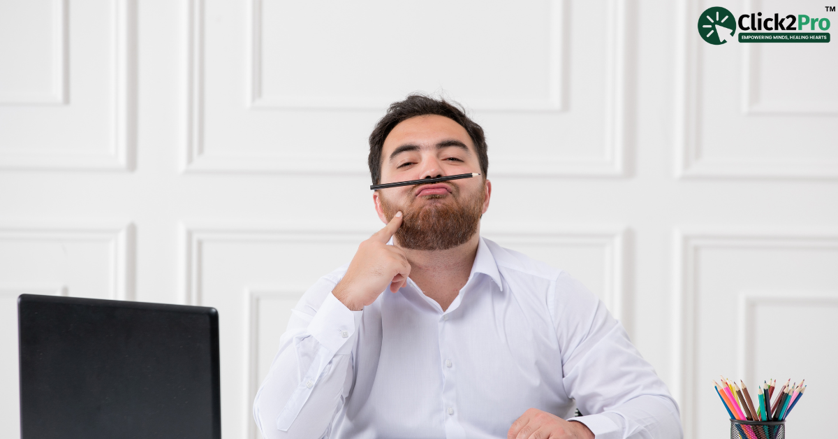 Man in a playful pose with a pencil, representing lighthearted moments; Click2Pro therapy services.