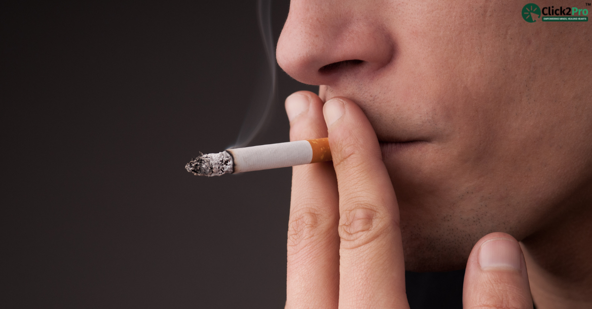 Person smoking a cigarette, highlighting the need for hypnotherapy to quit smoking effectively.