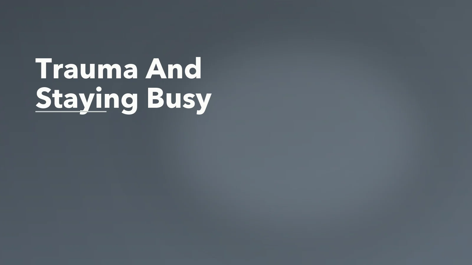 Editorial blog cover with the words 'Trauma And Staying Busy' for an article about trauma and the need to stay busy: why stillness can feel unsafe.