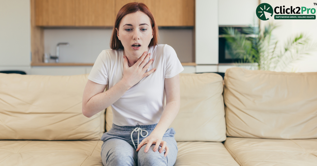 Young woman experiencing anxiety symptoms at home – A guide for caregivers of Somatic Symptom Disorder.