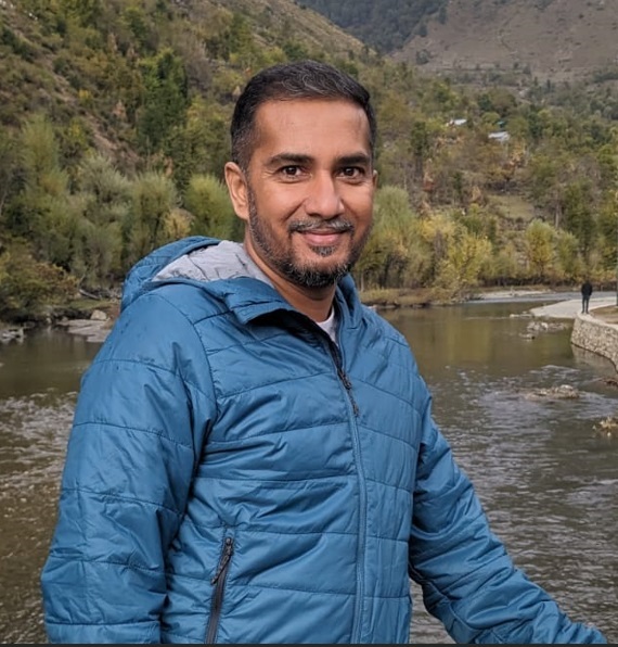 Click2Pro co-founder standing outdoors in a blue jacket